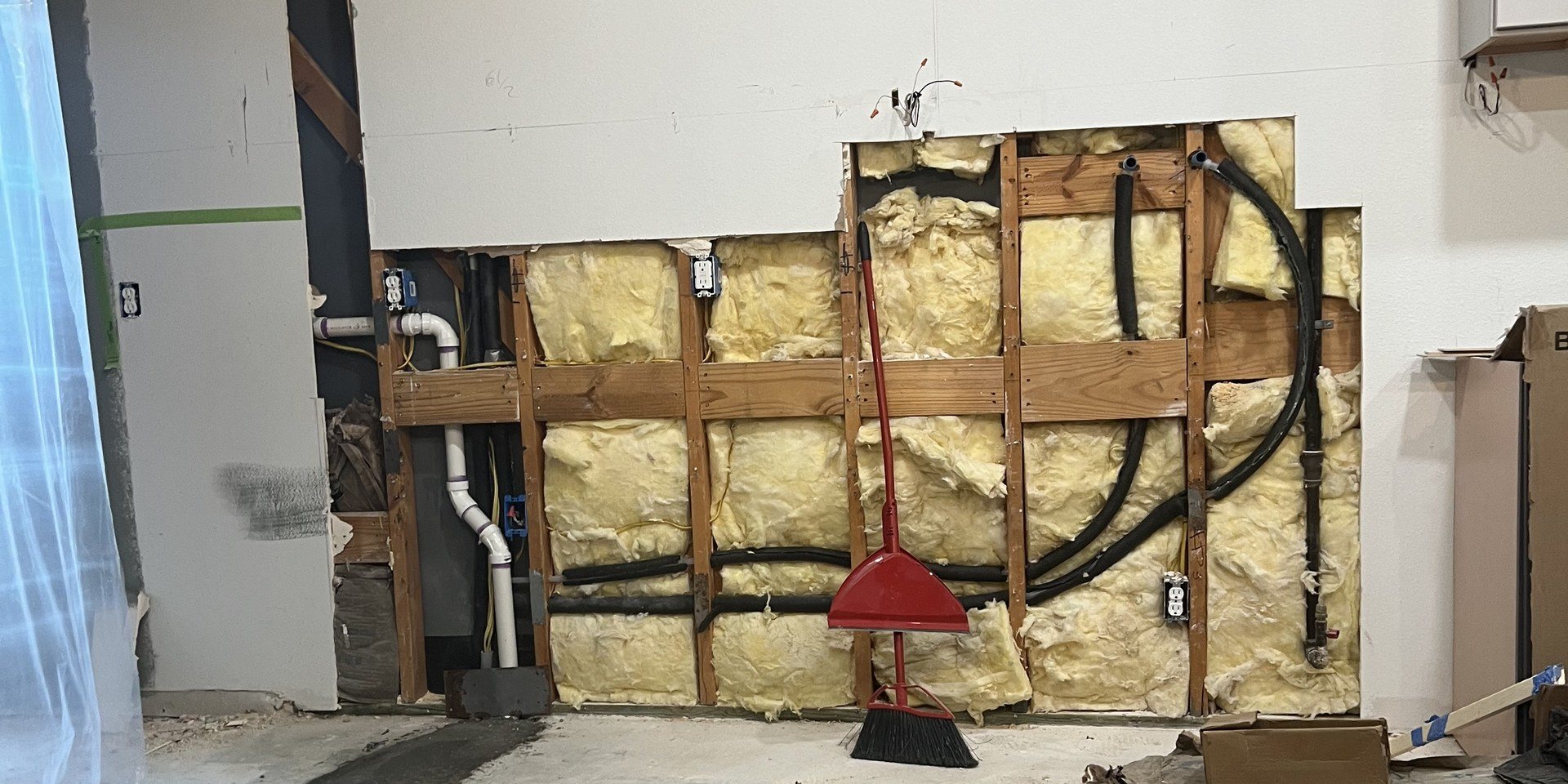 Flat-Out technician completing mechanical utility and refrigerant line routing for a residential home in Sugar Land, TX
