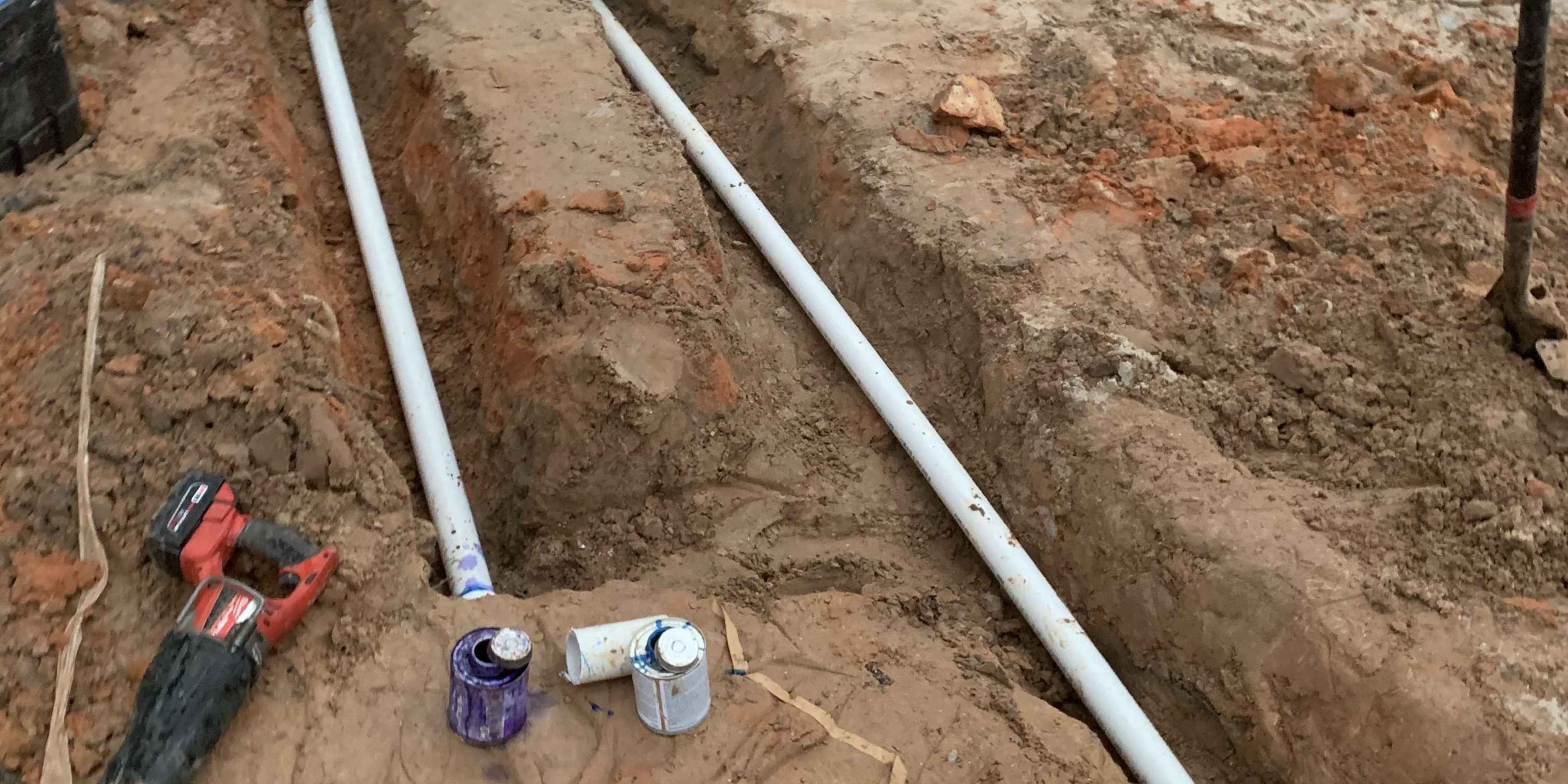 Flat-Out service vehicle and technicians performing emergency water extraction and site remediation in Conroe, TX