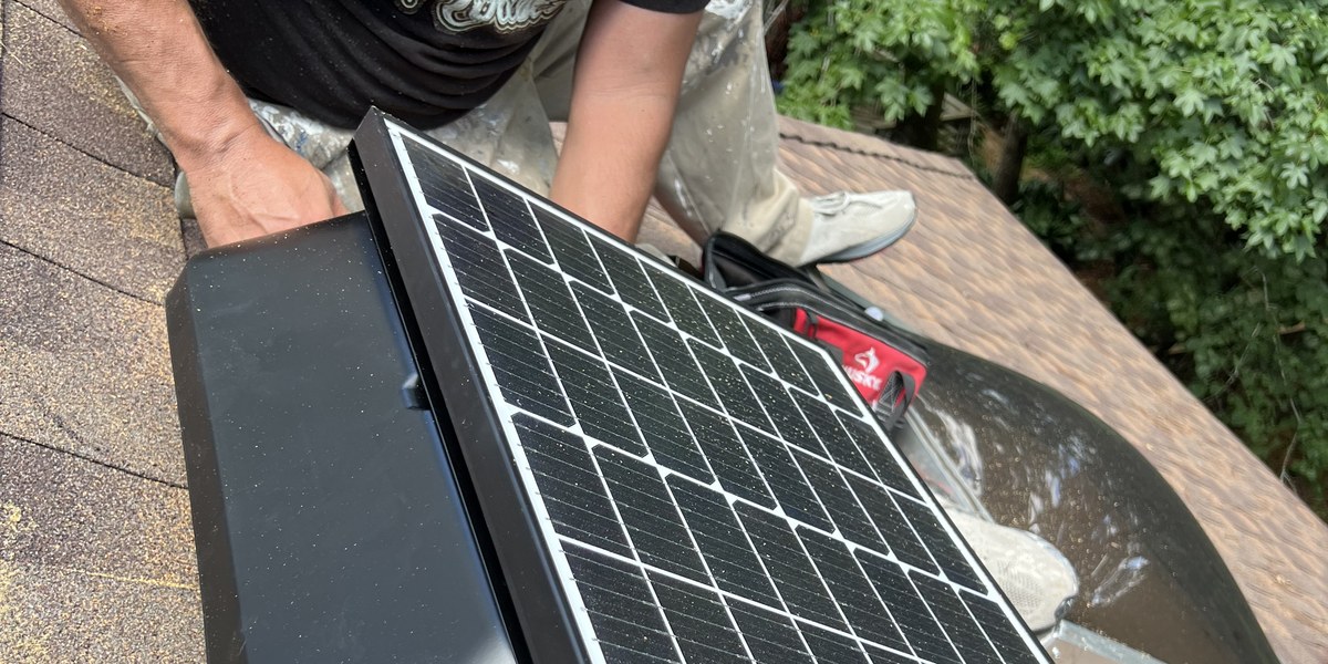 Solar powered attic ventilation fan installation on a residential roof in The Woodlands, TX